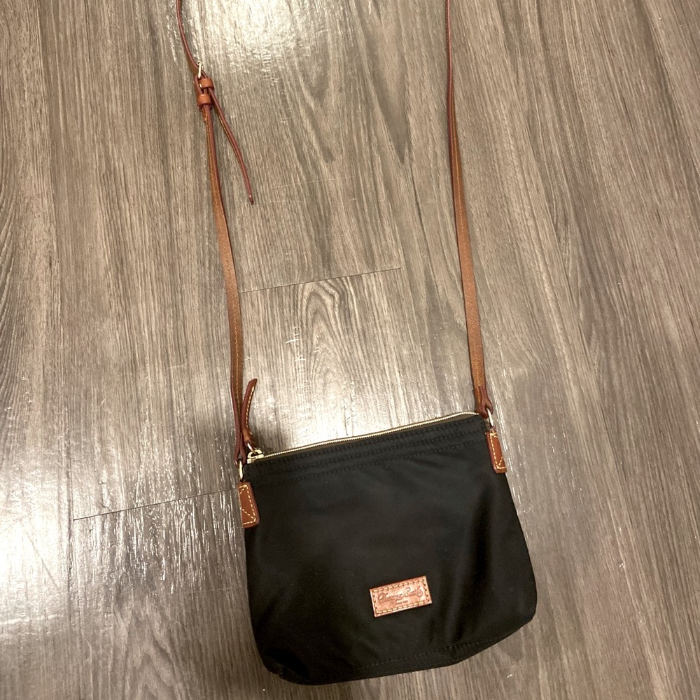 Dooney & Bourke crossbody bag. Black and brown. Used.